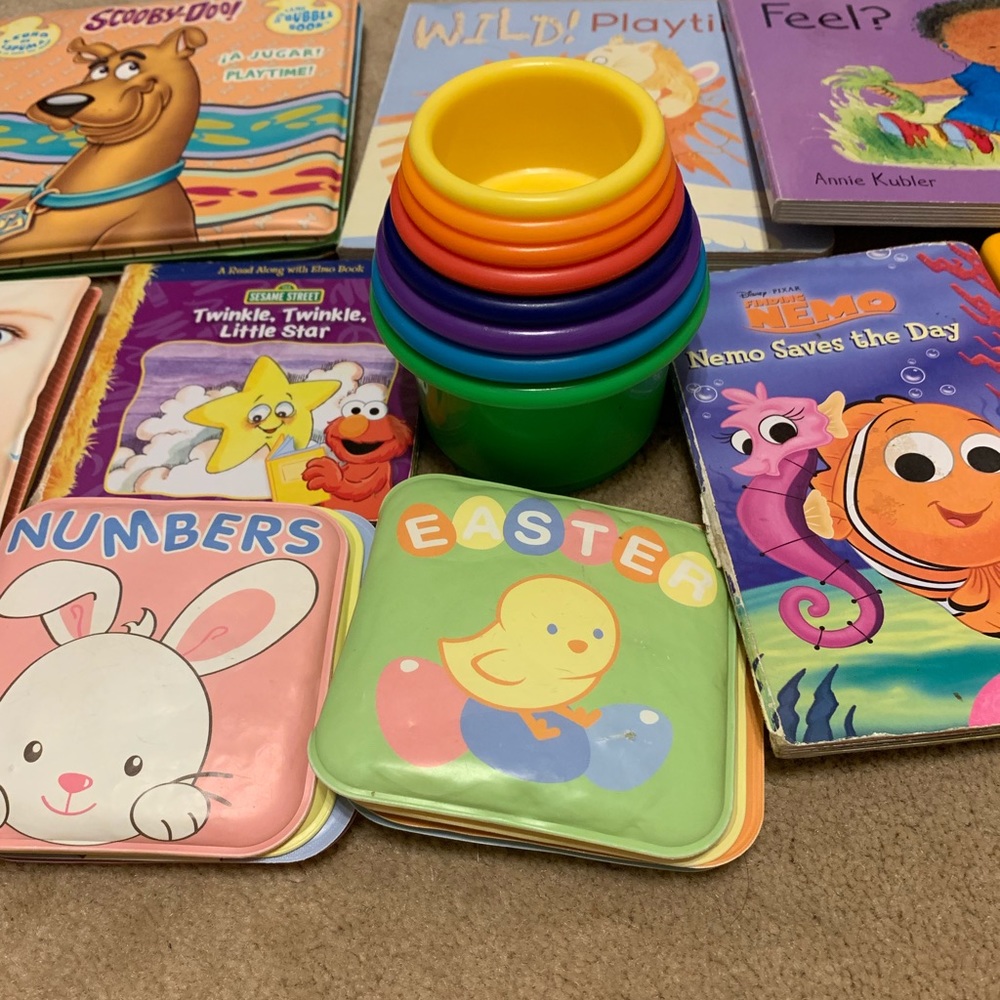Bundle of baby books with stacking cups